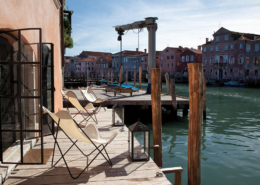 Chairs looking out on the docks in Venice