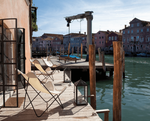 Chairs looking out on the docks in Venice