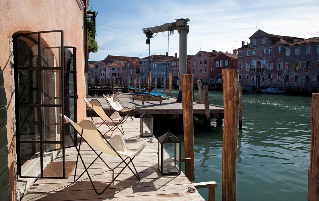 Chairs looking out on the docks in Venice