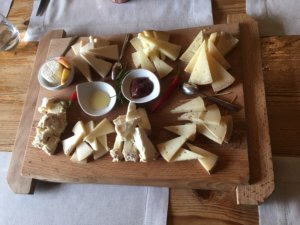 Pecorino & Caprino Cheese samples on a wooden tray