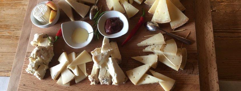 Pecorino & Caprino Cheese samples on a wooden tray